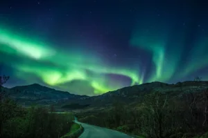 Northern Lights over the Mountains of Nusfjord, Lofoten