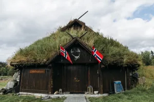 Turf-Roofed Barn with Norwegian Flags
