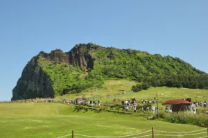 Visitors on the Meadow below Seongsan Ilchulbong